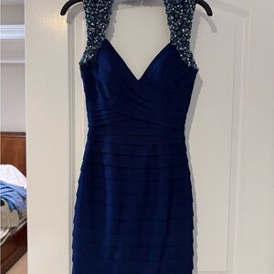 Elegant Blue Sleeveless Dress with Embellished Straps